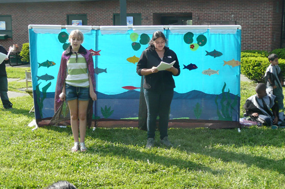 At the MyRWA's Annual Herring Run and Paddle, our two narrators introduce the play.